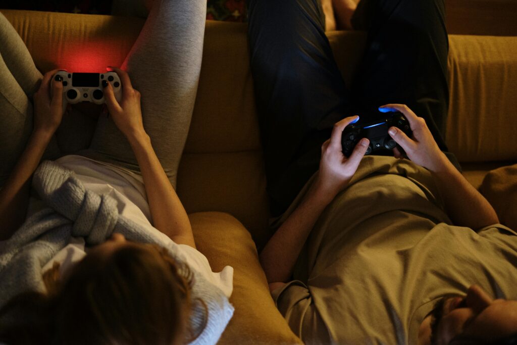 MPL Gaming Ban, People on couch playing video games.